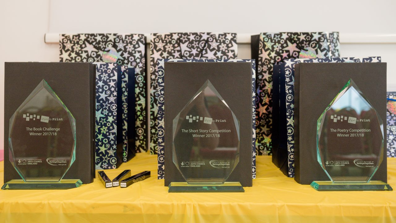 A row of Pen to Print trophies