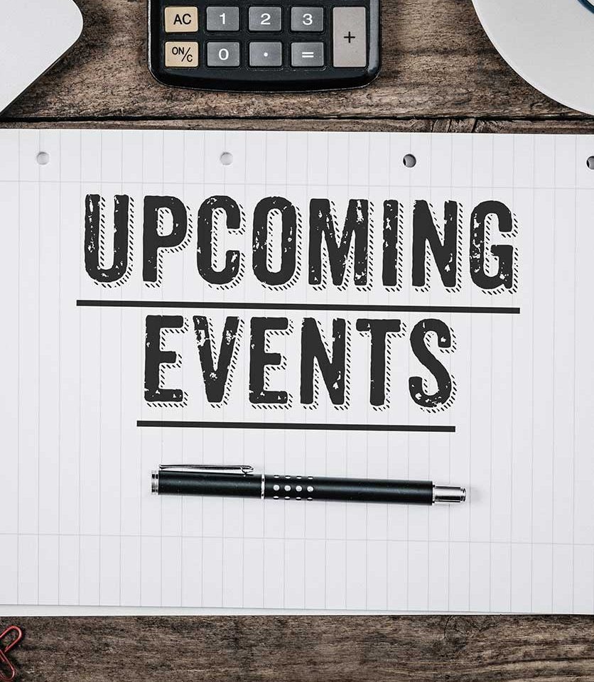 a keyboards and sheet of paper with a pen resting paper has caption Upcoming Events