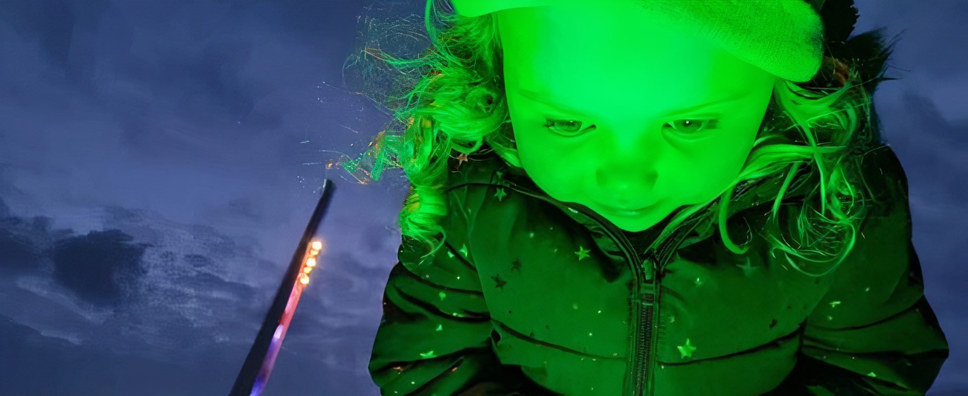 Little girl looking down to green lighting