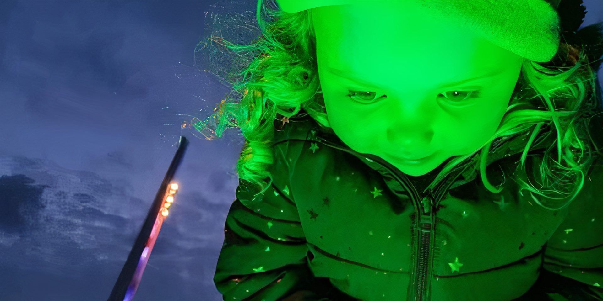 Little girl looking down to green lighting